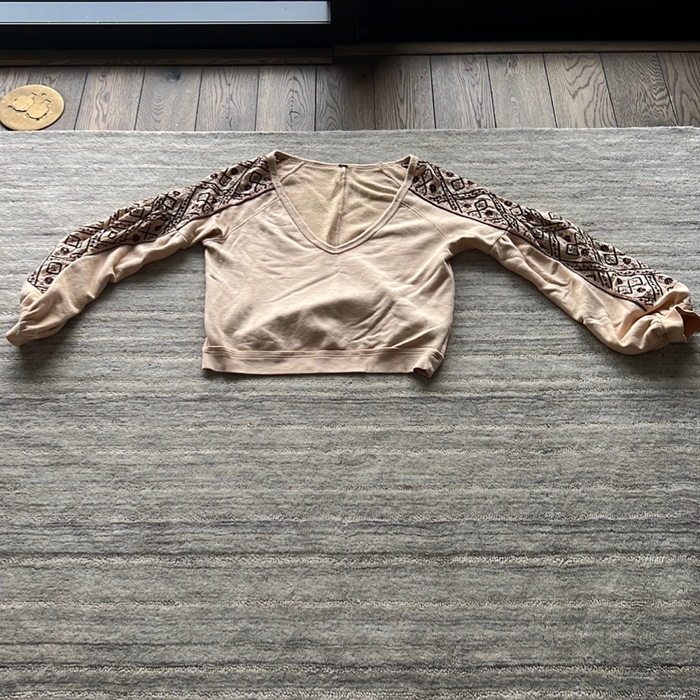 Boho Free People top with a flared sleeve